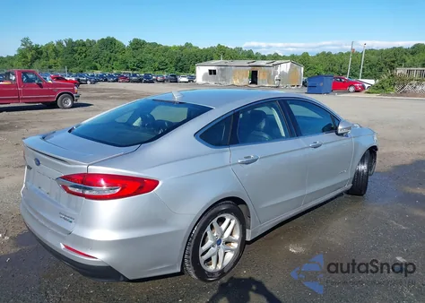 2019 Ford Fusion Hybrid Titanium from USA, damaged, VIN 3FA6P0RUXKR141565